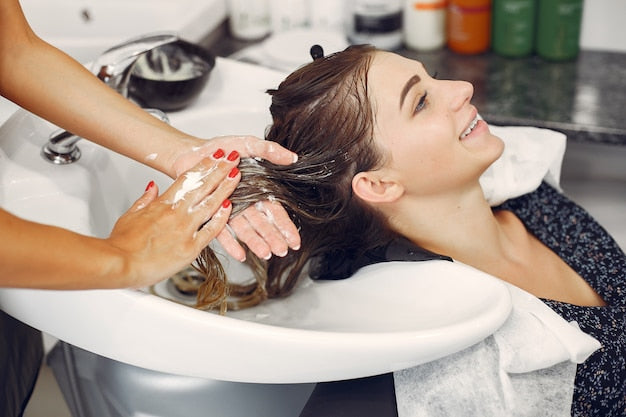 Free Photo | Woman washing head in a hairsalon